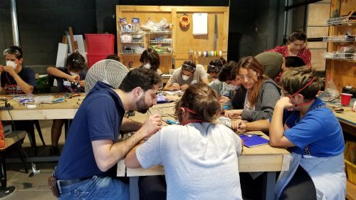 Nevan Hanumara working with students at a table